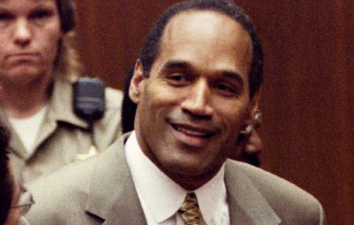 O.J. Simpson smiles on Oct. 3, 1995, after the court clerk announces he was found not guilty.