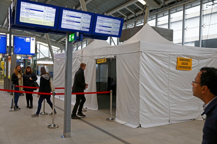 People cast their vote for the consultative referendum on the association between Ukraine and the European Union in a makeshi