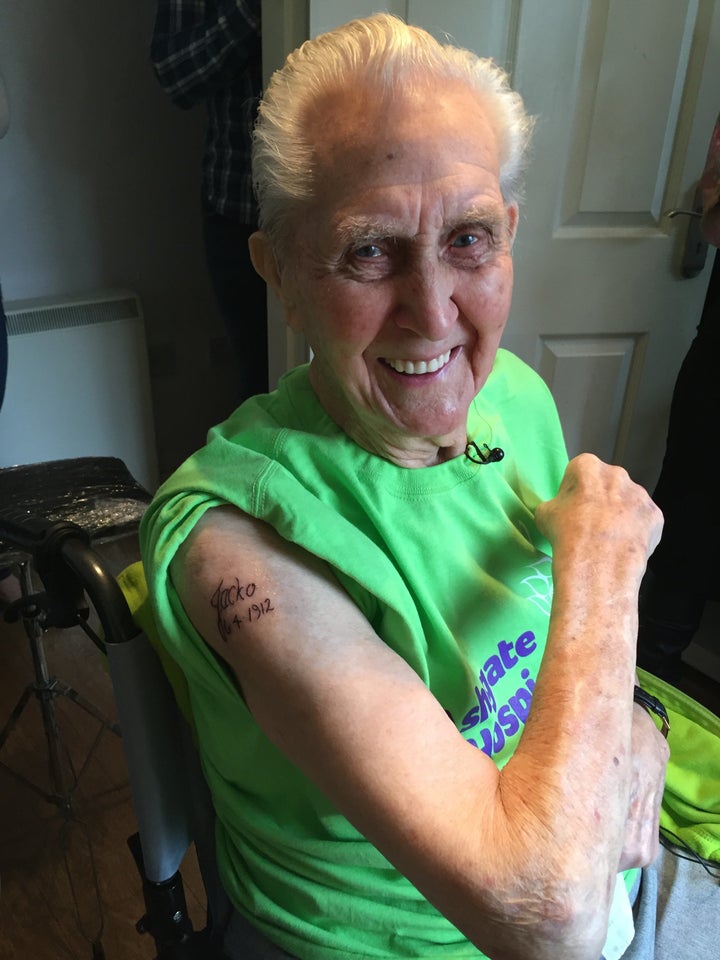 Jack Reynolds, shows off his first tattoo which he got at age 104. 