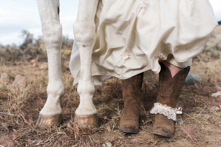 The bride and one of the horses showing off their hooves. 