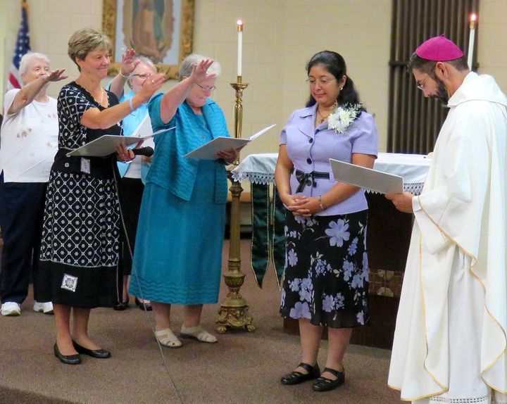 Sister Claudia Cano receives a blessing from her community.