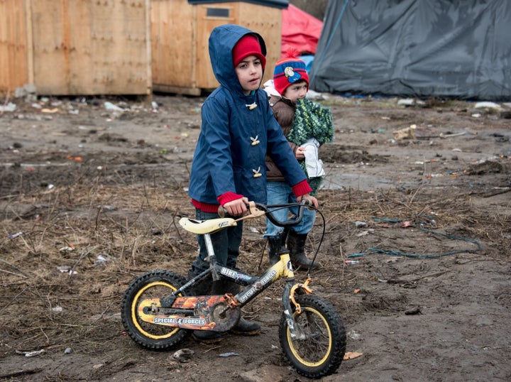 Migrant children play in the Calais 'jungle' camp