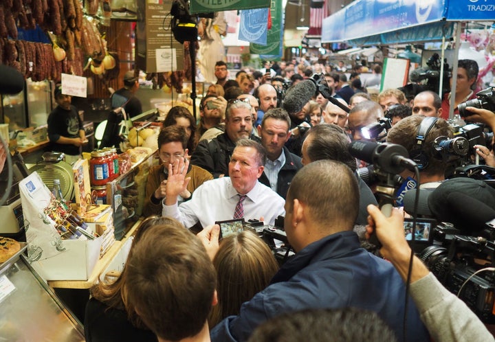 Journalists swarmed around John Kasich while he ate at a Bronx deli this week, part of an unusual presidential media frenzy e