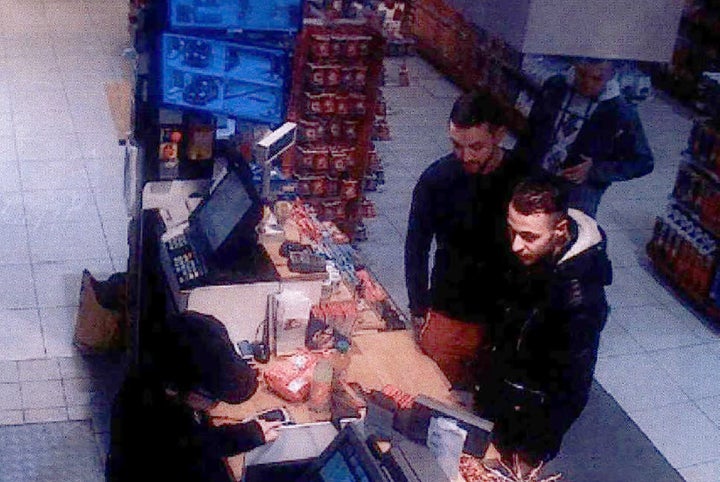 This video image taken from a CCTV camera at a petrol station in Ressons, North of Paris, on November 11, 2015 shows Salah Abdeslam (R), a suspect in the Paris attack of November 13, and Mohamed Abrini (C) buying goods. 