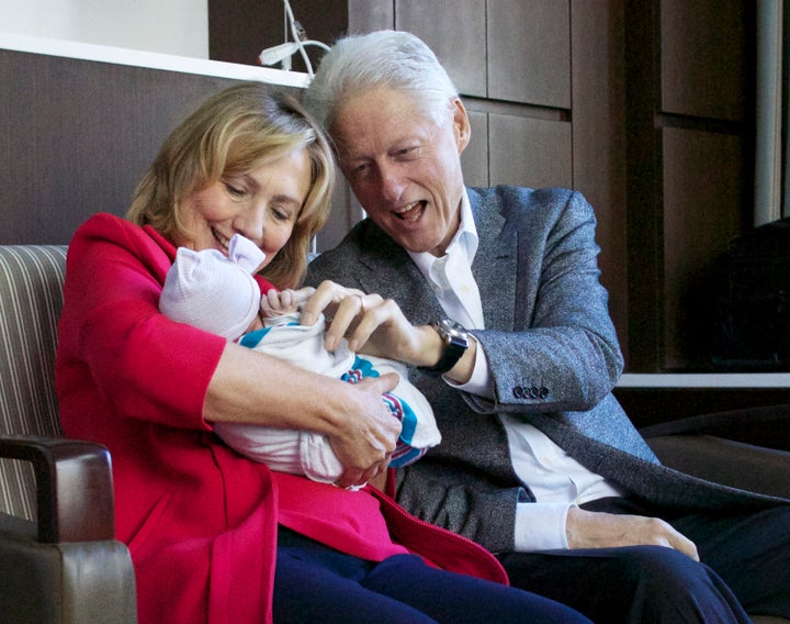 Bill and Hillary Clinton with their first grandchild, Charlotte Clinton Mezvinsky.