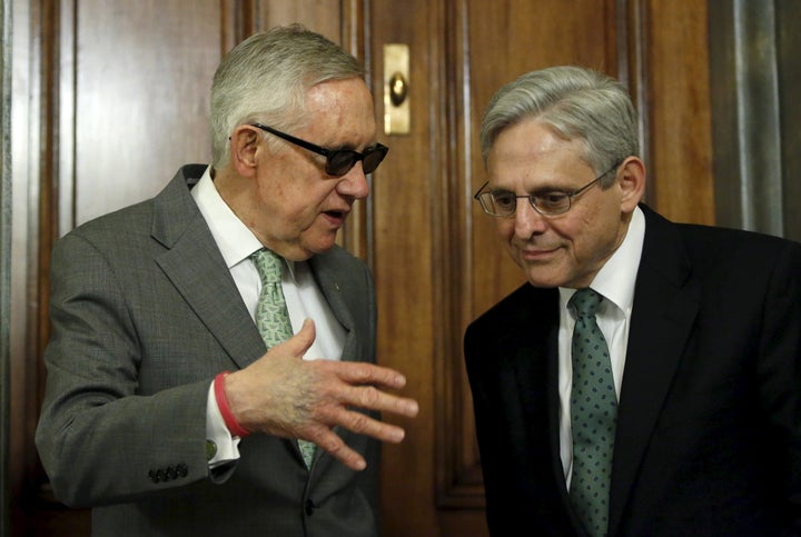 Senate Minority Leader Harry Reid (D-Nev.), left, meets with President Barack Obama's Supreme Court nominee Merrick Garl