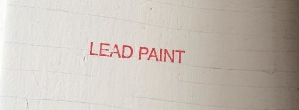 The words "Lead Paint" are stamped on the wall of an apartment where New York City health department inspectors found peeling lead-based paint.
