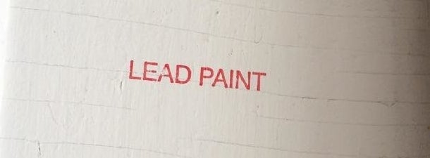 The words "Lead Paint" are stamped on the wall of an apartment where New York City health department inspectors found pe