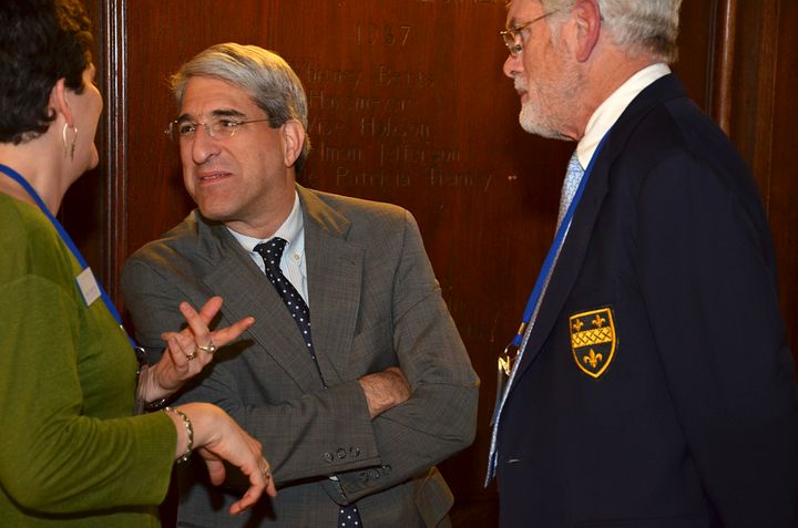 Jenny Chavira, deputy executive director of the Association of Yale Alumni, left, Peter Salovey, then-provost of Yale University, center, and Don Edwards, past president of the American Boychoir School, attend an alumni dinner at Yale University's Commons dining hall in New Haven, Connecitcut, U.S., on Oct. 6, 2012. 
