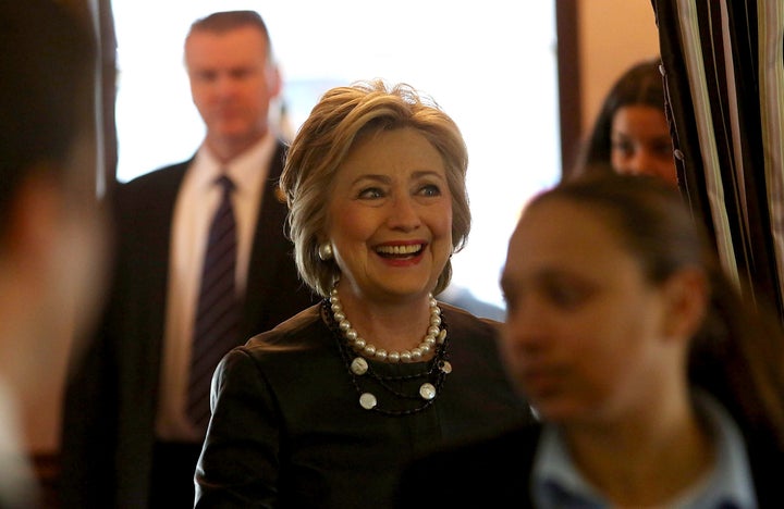 Hillary Clinton enters Make My Cake in Harlem.