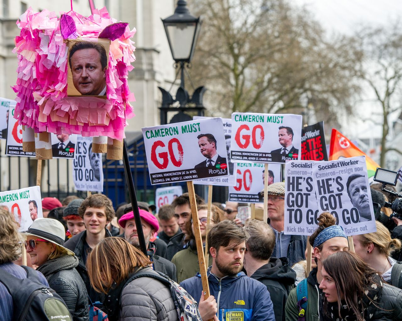David Cameron's face adorns a pig piñata during Saturday's #resigncameron demo