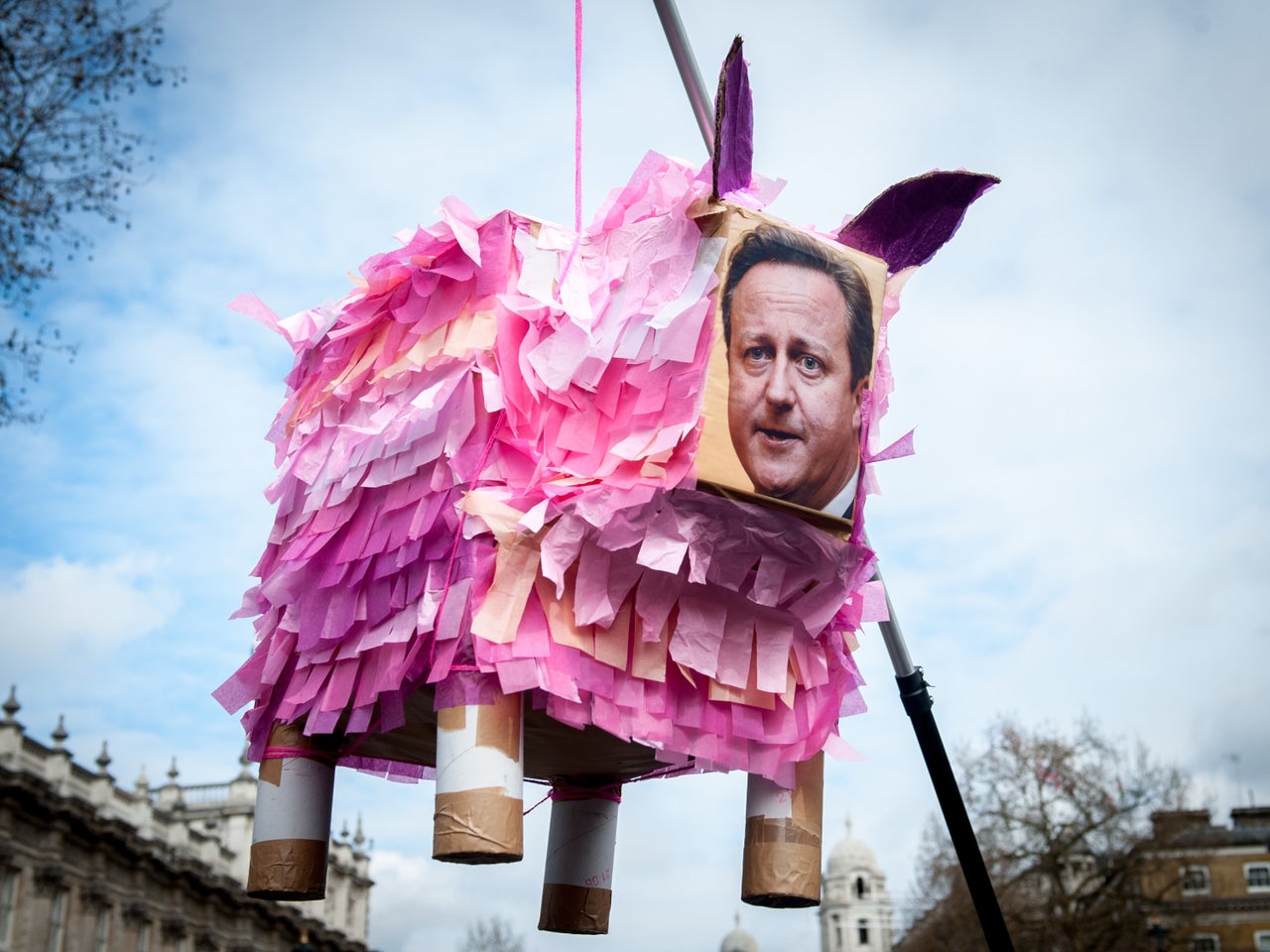 Gavin Turk's pig piñata led protestors during Saturday's march