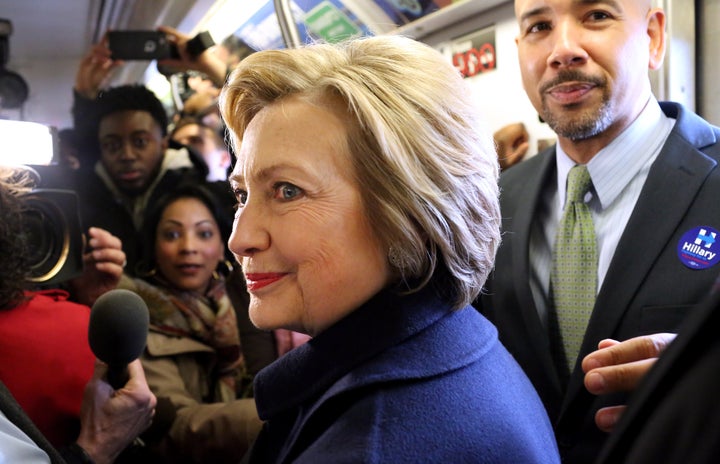 Hillary Clinton rides the subway in New York City.