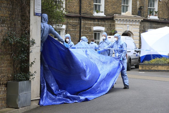 <strong>Police forensic officers work at the scene where Gordon Semple's body was found</strong>