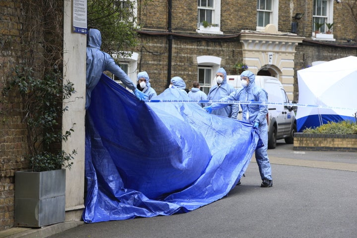 Police forensic officers work at the scene where Gordon Semple's body was found