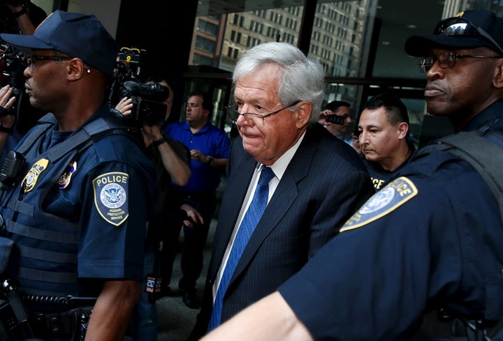 Former U.S. House of Representatives Speaker Dennis Hastert is surrounded by officers as he leaves federal court in Chicago, Illinois, on June 9, 2015.