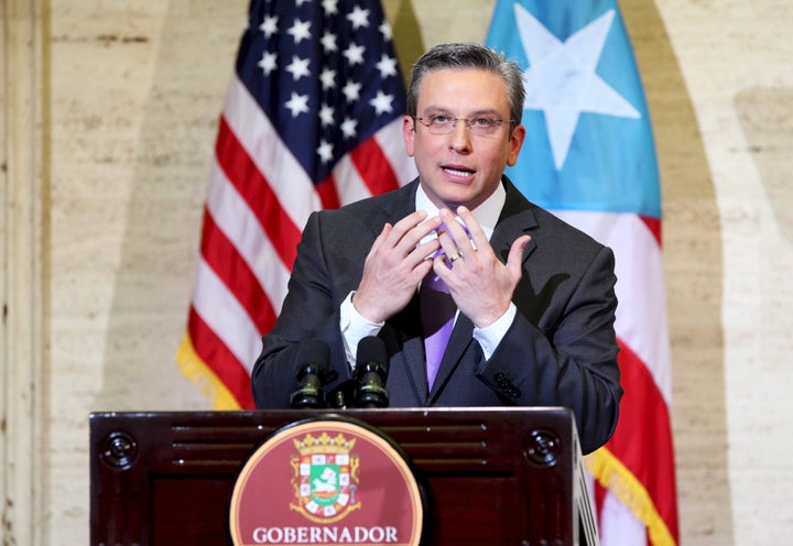 Puerto Rico's Governor Alejandro Garcia Padilla addresses the audience at the capitol building in San Juan, in this February