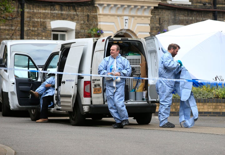 Forensic officers near the Southwark Street Estate where the remains of Pc Gordon Semple were found