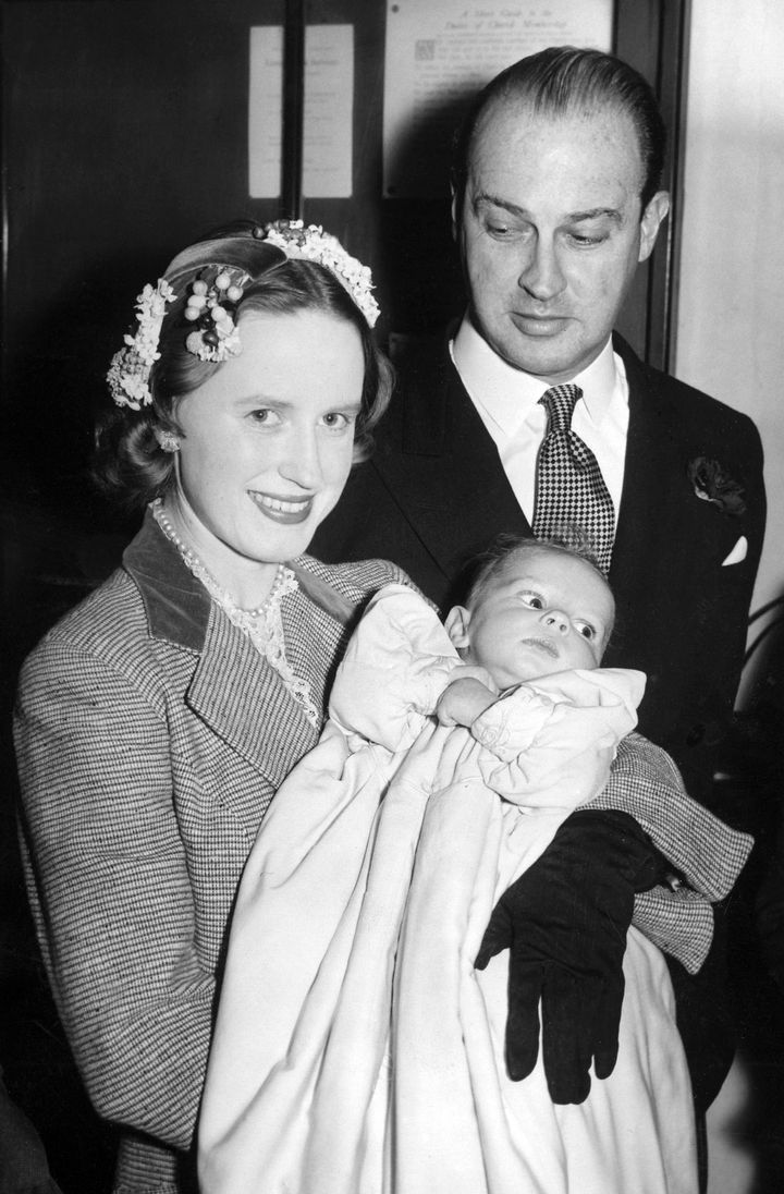 Gavin and Jane Welby with their baby son Justin at his christening