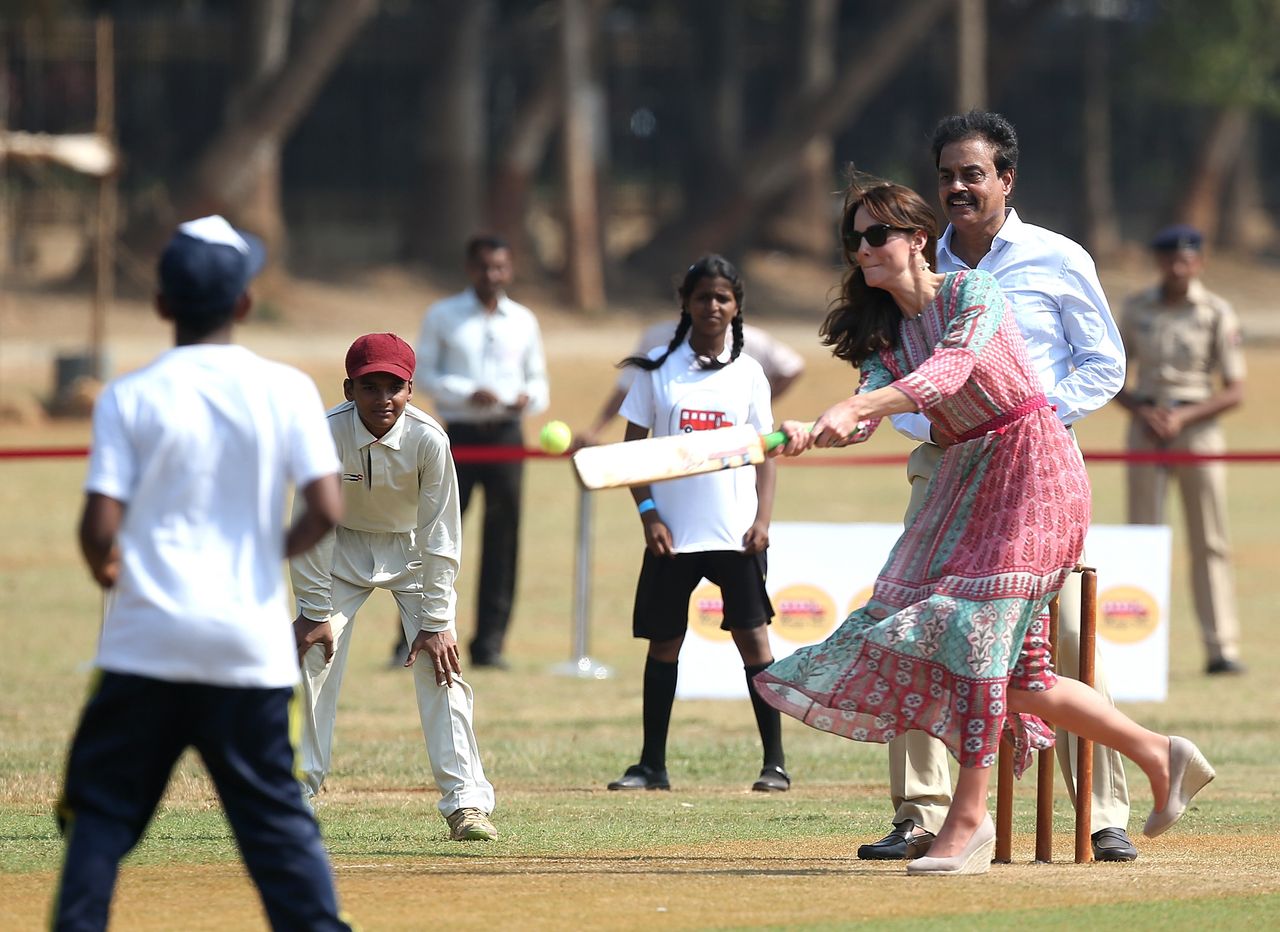 The Duchess of Cambridge join a local cricket game during a visit to meet children from Magic Bus, Childline and Doorstep in Mumbai.