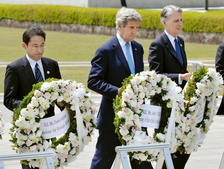 Japan's Foreign Minister Fumio Kishida (left), U.S. Secretary of State John Kerry (middle) and Britain's Foreign Mi
