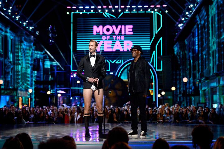 Alexander Skarsgard and Samuel L. Jackson speak onstage during the 2016 MTV Movie Awards. 