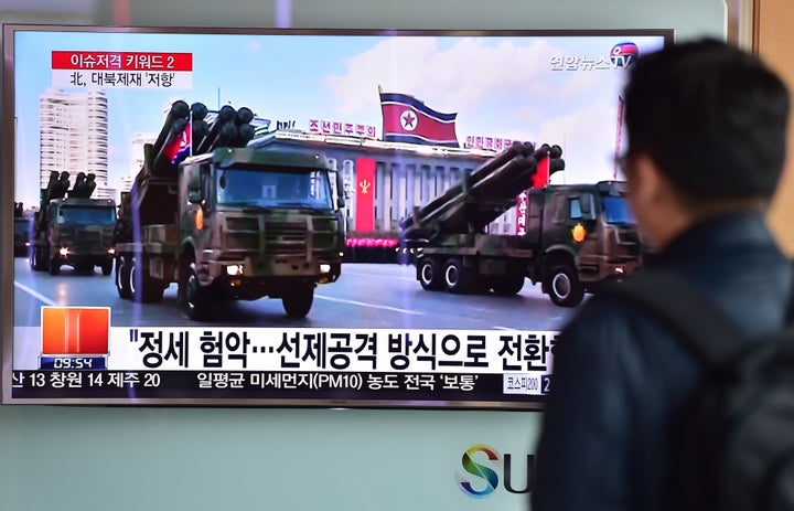 News of the defections comes amid tensions following the North's nuclear test and impending long-range rocket launch next month. A man in Seoul watches footage of North Korean missiles on parade.