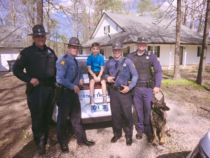 Toxey Andrews and the state troopers who threw him a surprise party.