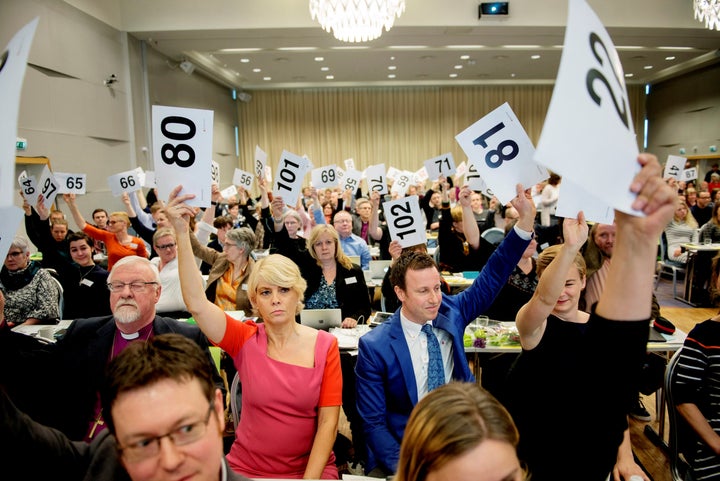 Norwegian Church Council leader Kristin Gunleiksrud Raaum and Chairman of the Oslo diocesan council Gard Sandaker-Nielsen vote on a proposal to allow same-sex marriage within the Norwegian Church, in Oslo, Norway April 11, 2016.