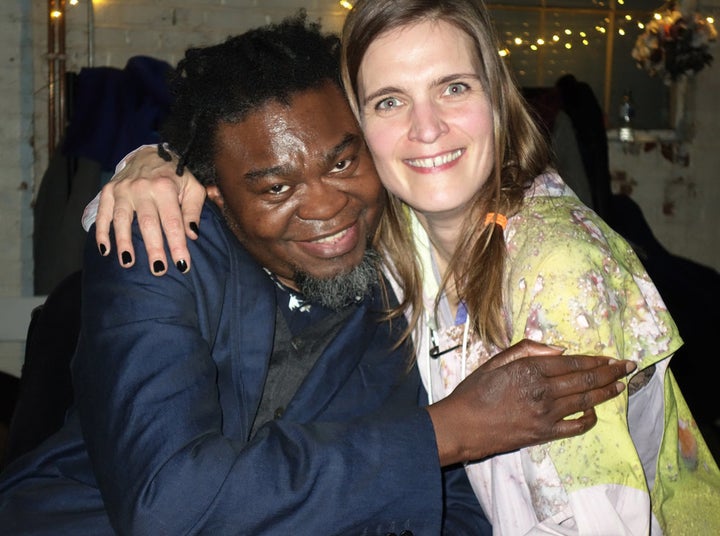 British-Nigerian artist Yinka Shonibare hugs German Katrin Lock.