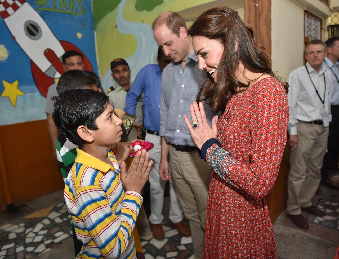 The Duke and Duchess of Cambridge with street children at a contact centre run by the charity Salaam Baalak.