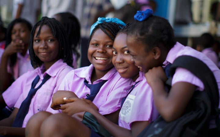 Students in school uniforms pose for a photo in Beira, Mozambique. 