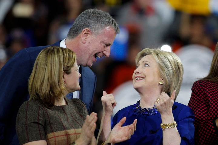 Hillary Clinton speaks with New York City Mayor Bill de Blasio after a rally at the Javits Center on March 2, 2016 in New Yor