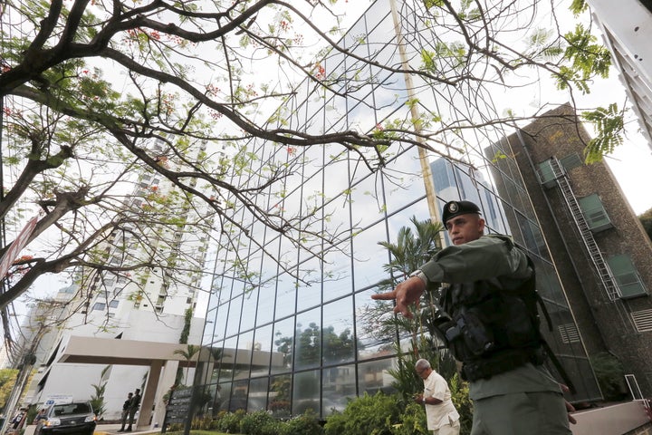 A police officer gestures as he stands guard outside the Mossack Fonseca law firm office in Panama City April 12, 2016.