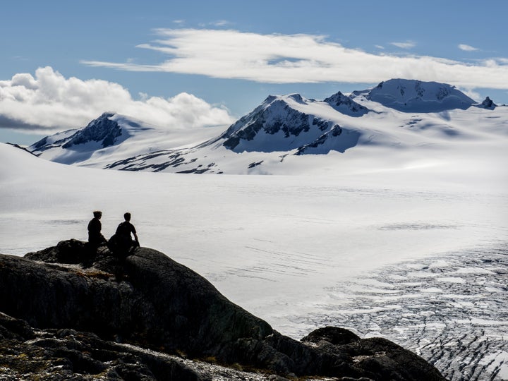 A young couple is seen overlooking Alaska's Harding Glacier Field in the Kenai Peninsula where a pair of skiers recently beca