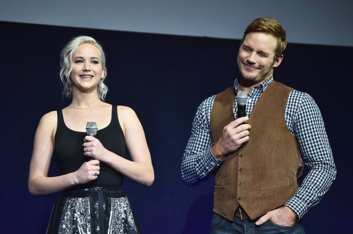 Actress Jennifer Lawrence (L) and actor Chris Pratt speak onstage during CinemaCon 2016. 