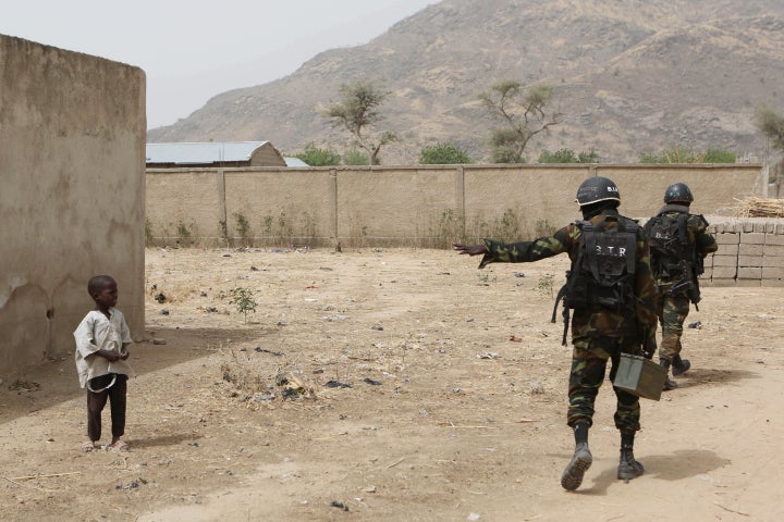 There are countless girls whose names are not known who have been abducted since the Chibok kidnapping caught international attention. Here, Cameroonian soldiers tell a young boy to stay back while on patrol in March.