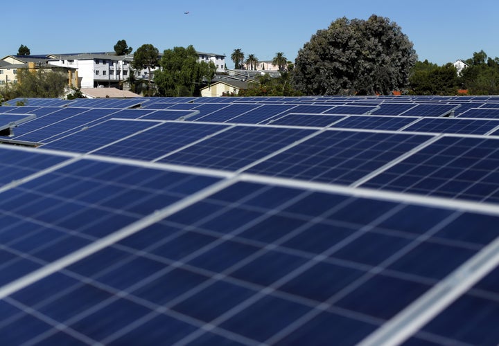 Solar panels on top of a Multifamily Affordable Solar Housing-funded housing complex in National City, California.