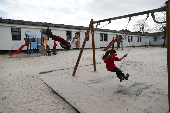 A new civic action group in Germany named 83 INTEGRIERT facilitates flatshares for refugees, acting as an interlocutor between the refugees and potential hosts. Children play at a camp for migrants and refugees in Friedland, Germany.
