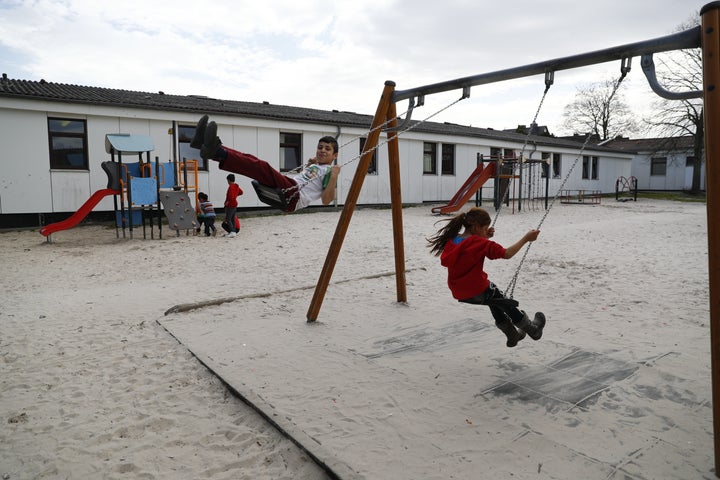 A new civic action group in Germany named 83 INTEGRIERT facilitates flatshares for refugees, acting as an interlocutor between the refugees and potential hosts. Children play at a camp for migrants and refugees in Friedland, Germany.