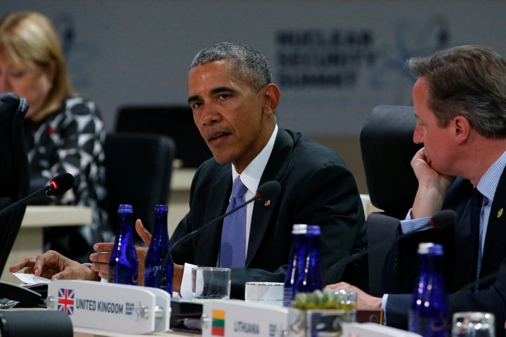 U.S. President Barack Obama, sitting with Britain's Prime Minister David Cameron, delivers remarks to start the second and final plenary session of the Nuclear Security Summit in Washington April 1, 2016.