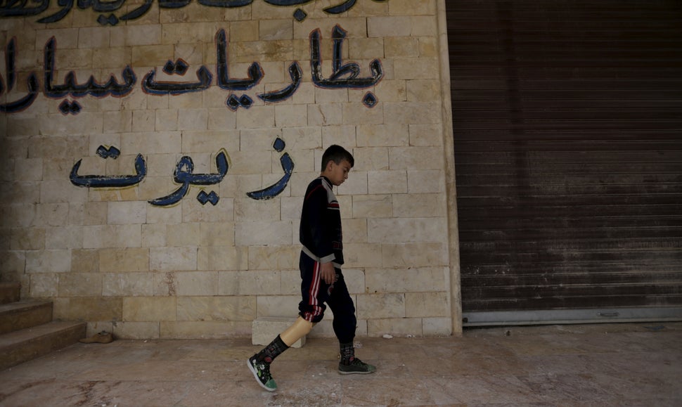 In each location the mobile clinic visits, keeping patients safe from bombing is a recurrent problem, Khamis says. A boy walk