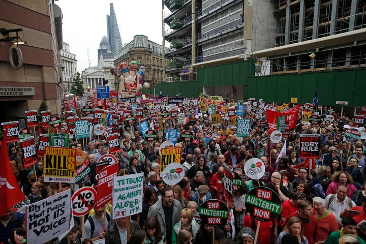 Demonstrators march during an anti-austerity protest in central London, Britain June 20, 2015