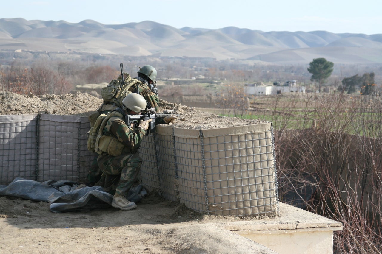 Marines with the 2nd Marine Special Operations Battalion scan the horizon during a patrol through Bala Marghab, Afghanistan.