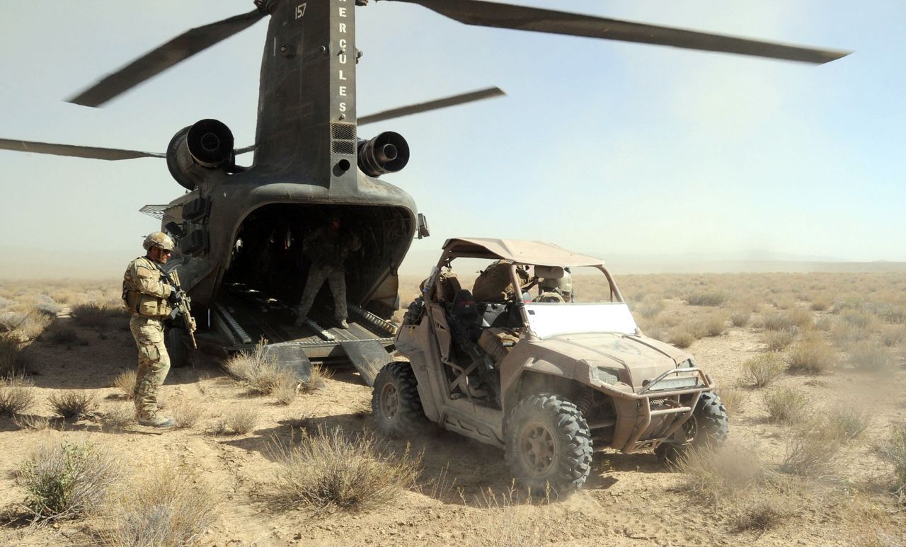 Soldiers with Special Operations Task Force-South load an all-terrain vehicle onto a CH-47 Chinook helicopter during operations in Kandahar Province, Afghanistan.
