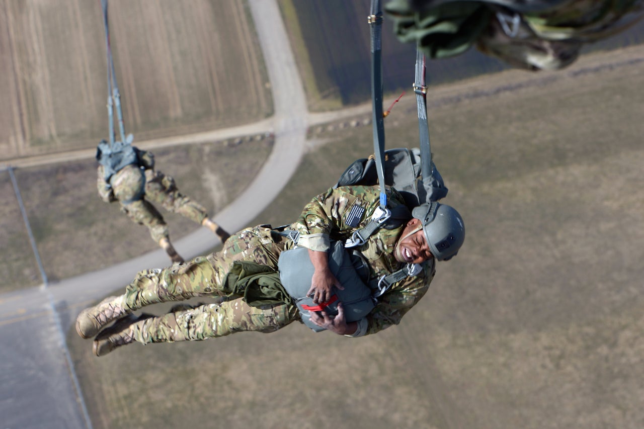 A soldier assigned to 10th Special Forces Group (Airborne) free-falls after jumping out of a C-130 Hercules aircraft over Germany.