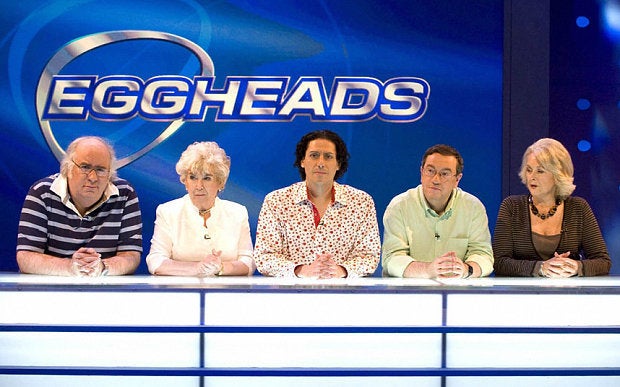 CJ (centre) has been on the 'Eggheads' panel since it debuted in 2003