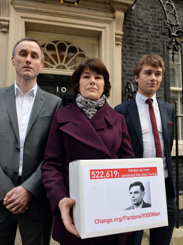 Alan Turing's family hand in a petition at number 10 Downing Street calling for the 49,000 people convicted under British anti-gay laws to be pardoned.