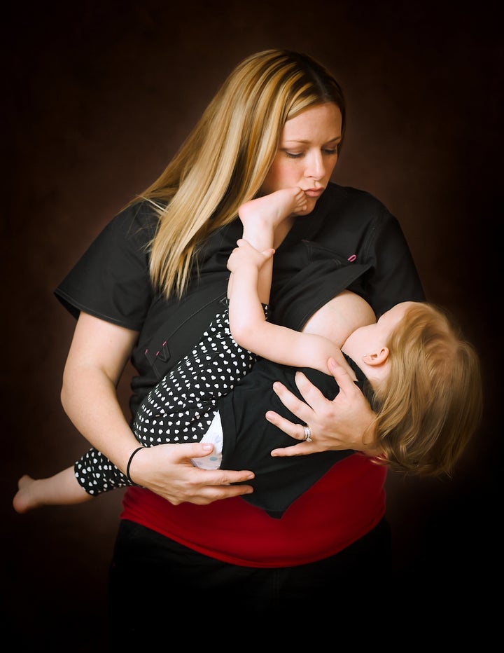 A labor and delivery nurse breastfeeds her daughter.