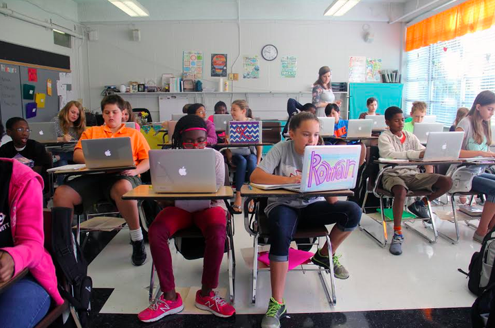 Students at Lovett Elementary, the Clinton, Miss. school district's sixth-grade-only school, work on laptops during class. The district has provided iPads or laptops to all students for several years.